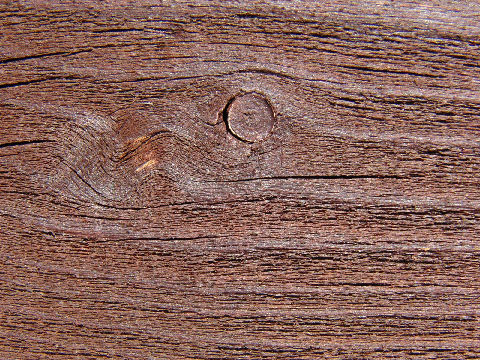 Holzbrett rotbraun mit Astloch Holzbrett rotbraun mit Astloch